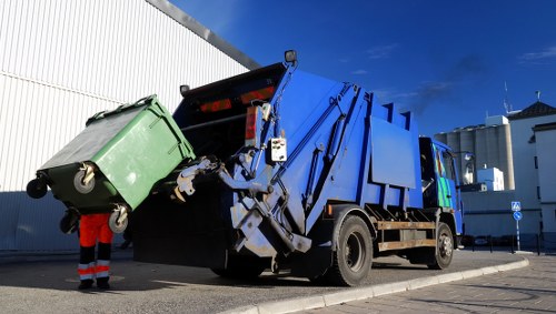Van and crew loading commercial waste on Tottenham High Road